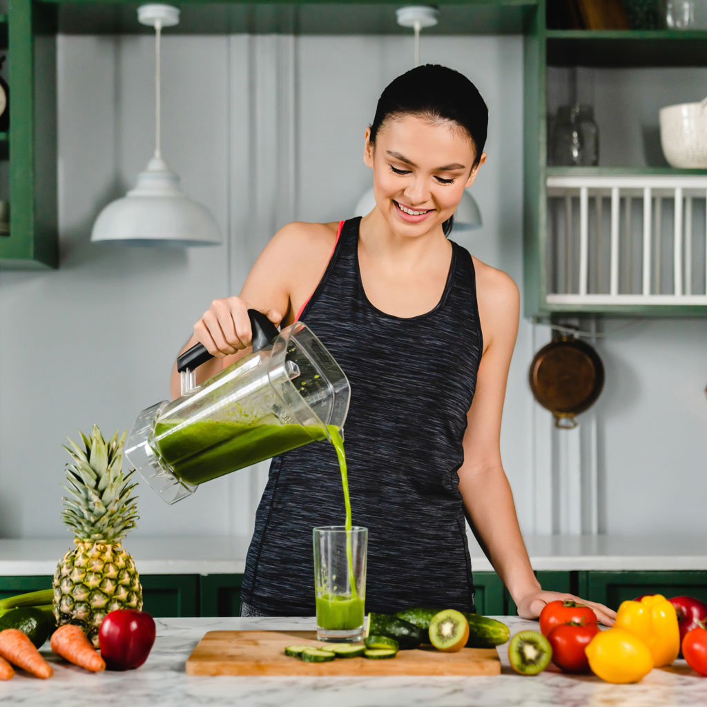 healthy young woman drinking fresh detox juice